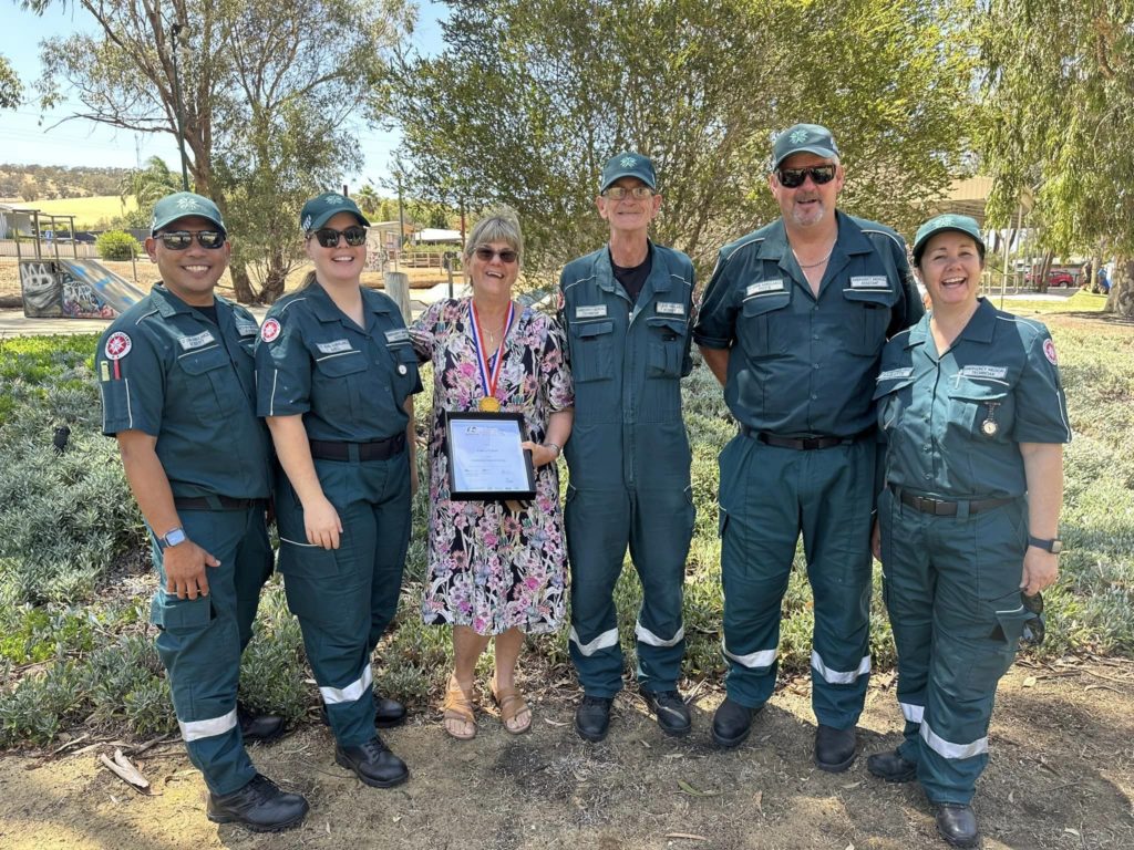 EMT Cathy Fisher with her Chittering crew after winning Citizen of the Year.